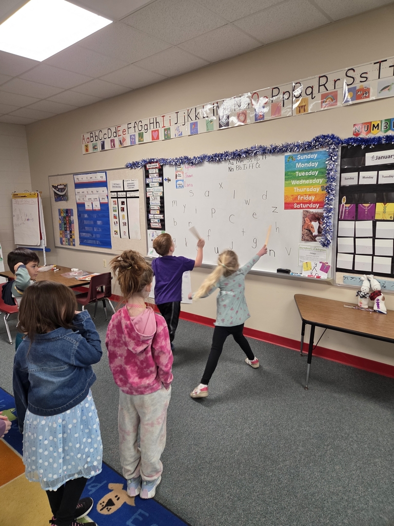 Playing a letter and sound game.