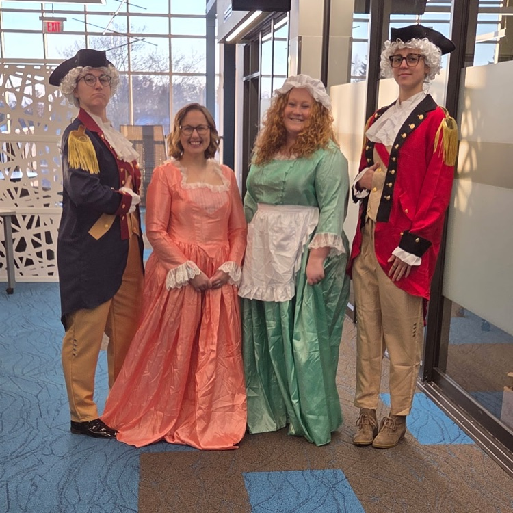 4 teachers in Colonial dress