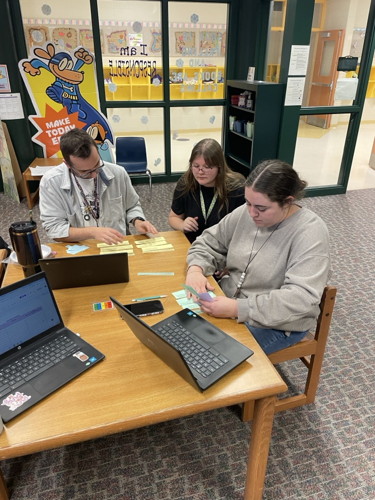 Teachers working together to learn about standards and UDL