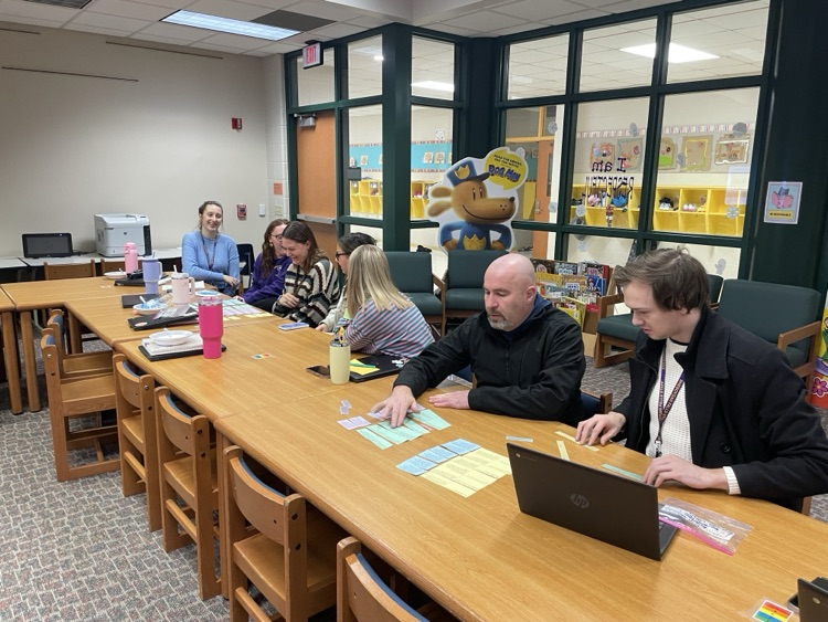 Teachers working together to learn about standards and UDL