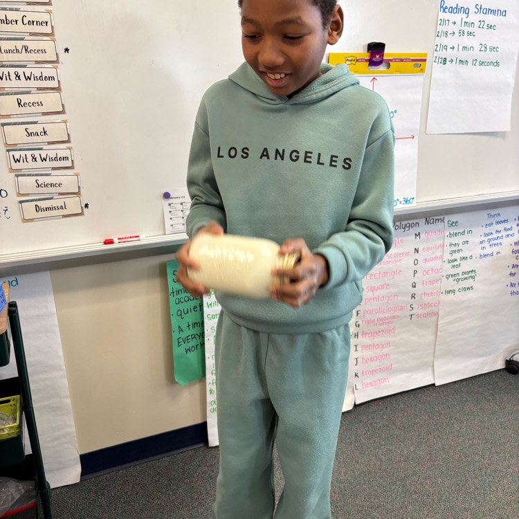 student shaking butter