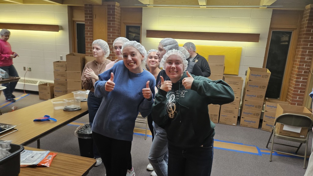 Sheboygan Falls High School National  Honors Students volunteer at the "Feed My Starving Children" event.