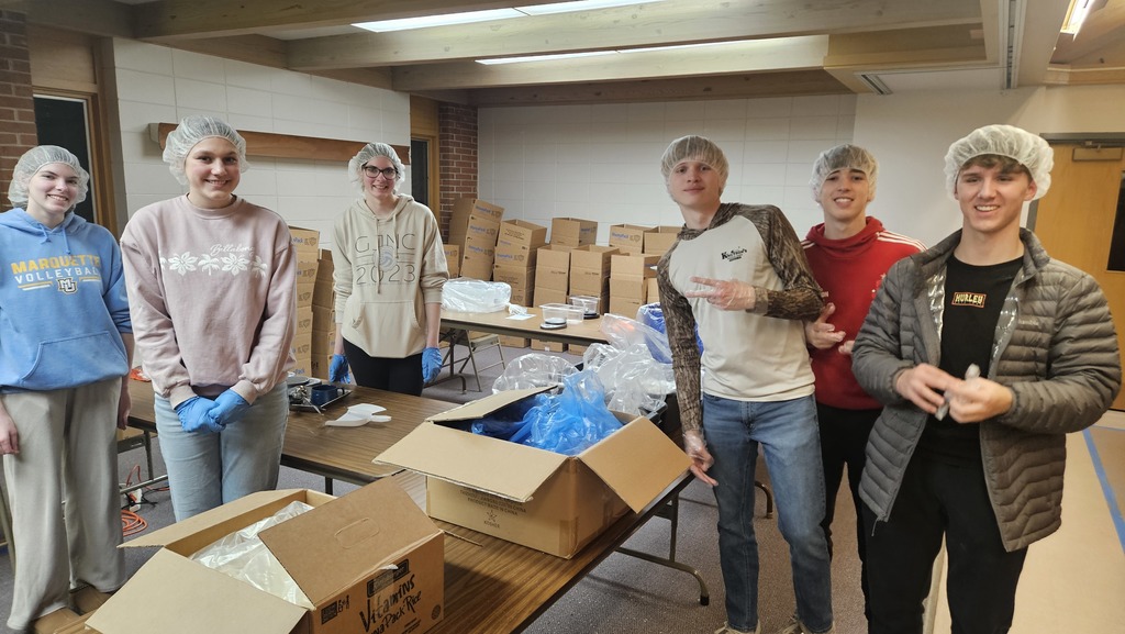 Sheboygan Falls High School National  Honors Students volunteer at the "Feed My Starving Children" event.