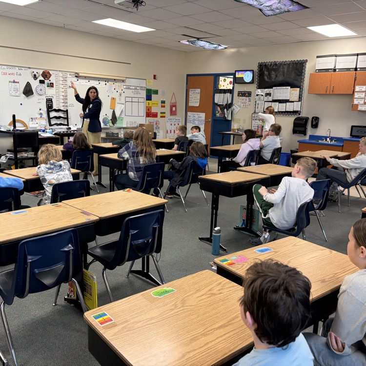 students listening to guess speaker, Representative Lindee Brill