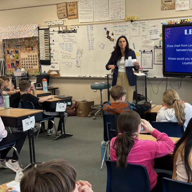 students listening to guess speaker, Representative Lindee Brill