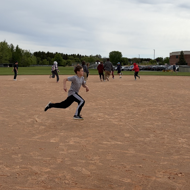 student running from 3rd base to home plate