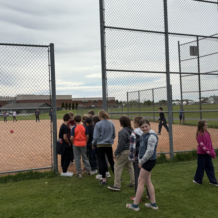 students lined up waiting for their turn to kick