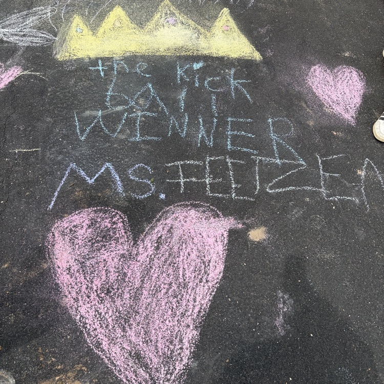 chalk writing congratulating the kickball winners