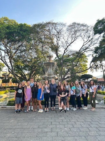 Mrs. Olig and SFHS students in Antigua, Guatemala in front of a fountain