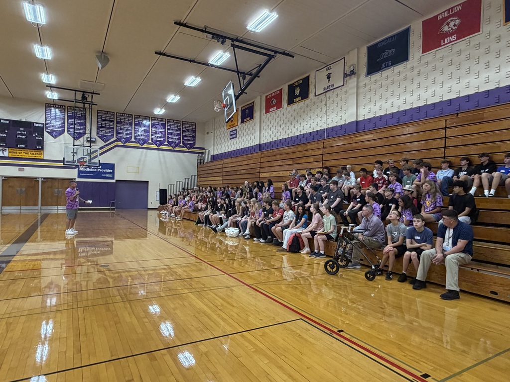 Sheboygan Falls High School freshman are greeted by teachers in the gym.
