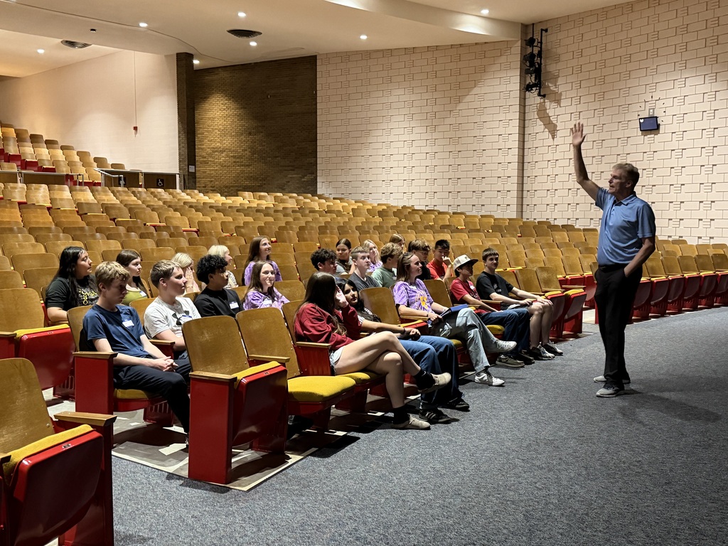 Sheboygan Falls High School students listening to Mike McGown in the high school auditorium.
