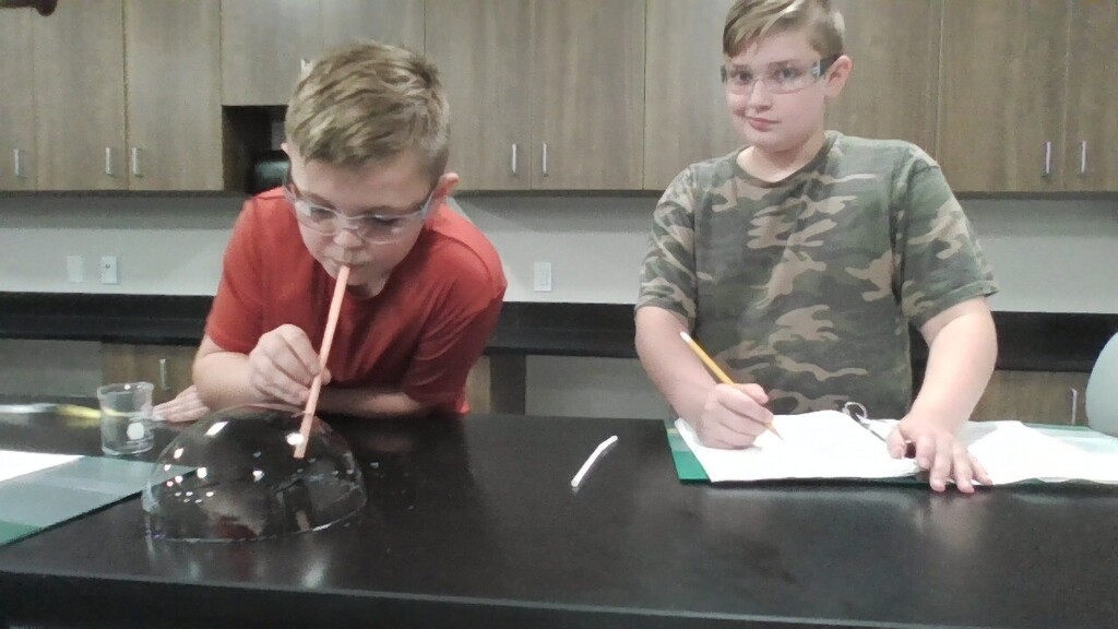 Two students complete a lab. 