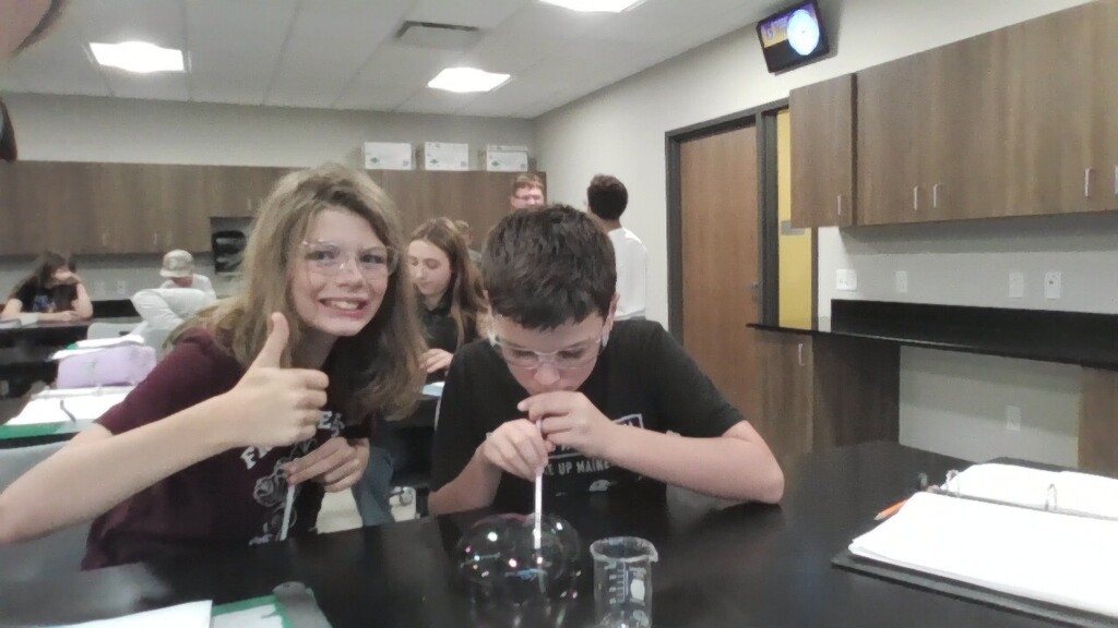Two students complete a lab. 