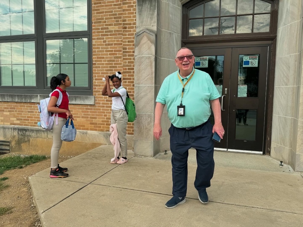 Families standing outside during entry