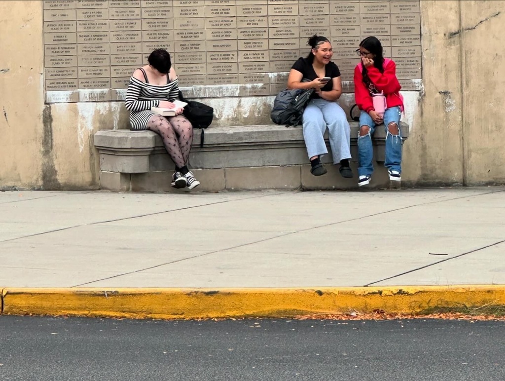 Families standing outside during entry