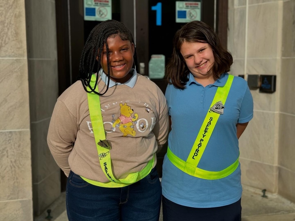 Families standing outside during entry
