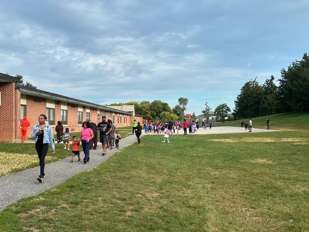 Families standing outside during entry
