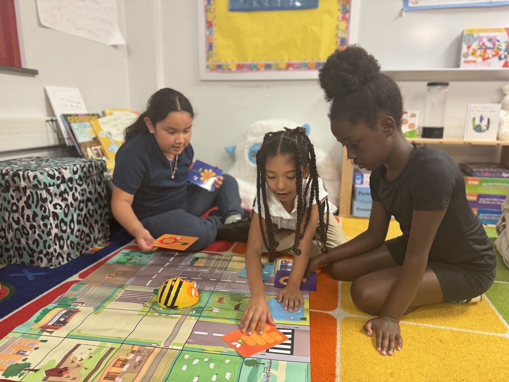 Students participating in a coding activity in their classroom