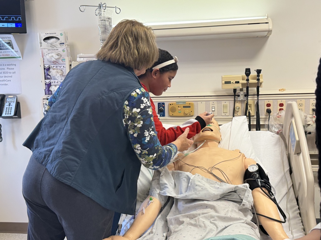 Students and adults participating in interactive activities at York College of Pennsylvania