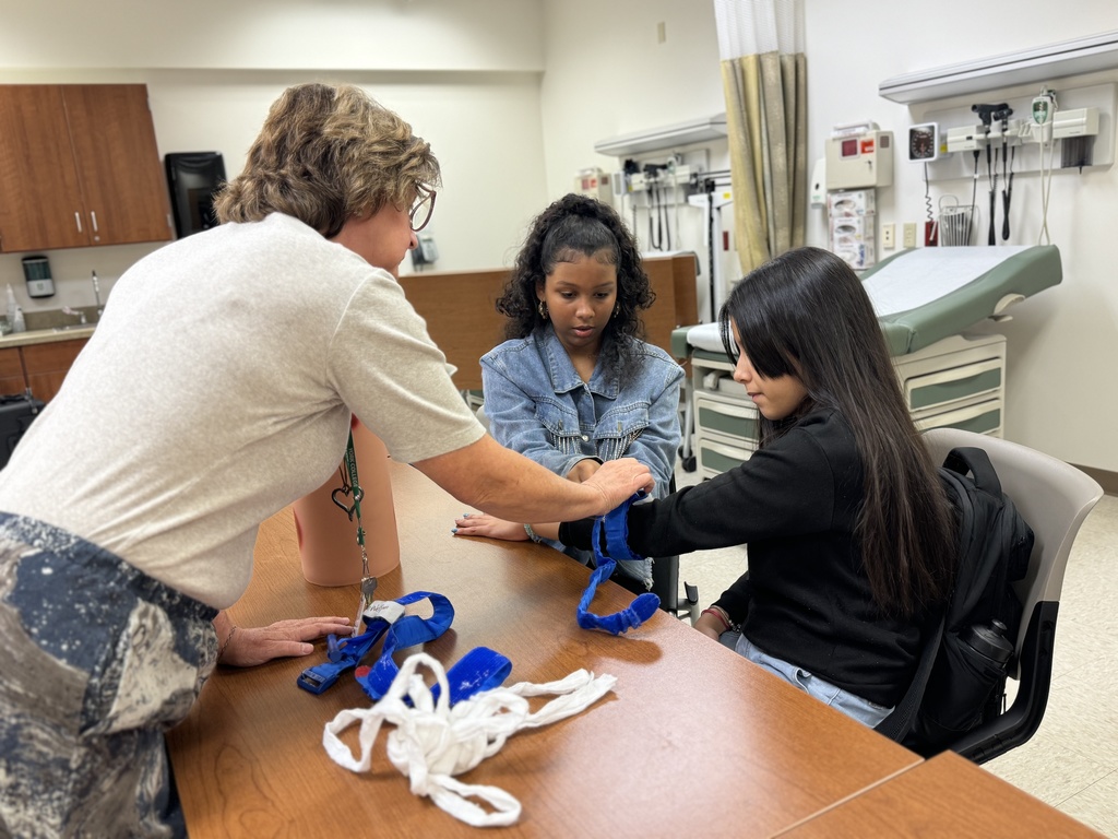 Students and adults participating in interactive activities at York College of Pennsylvania