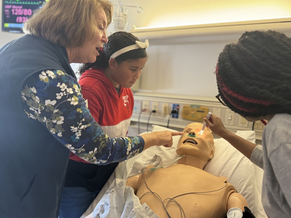 Students and adults participating in interactive activities at York College of Pennsylvania