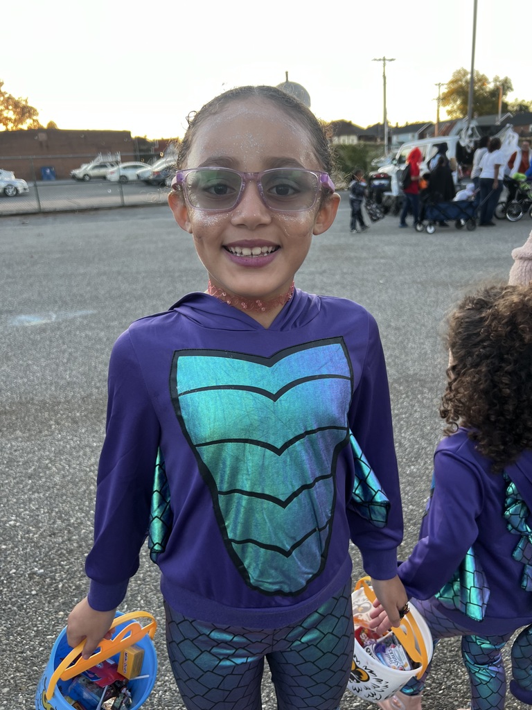 Student and families participating at their school's trunk or treat outside