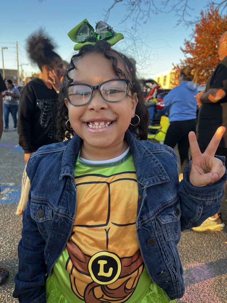 Student and families participating at their school's trunk or treat outside