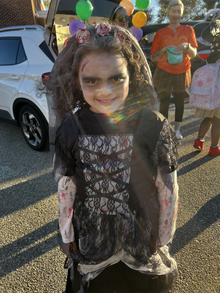 Student and families participating at their school's trunk or treat outside
