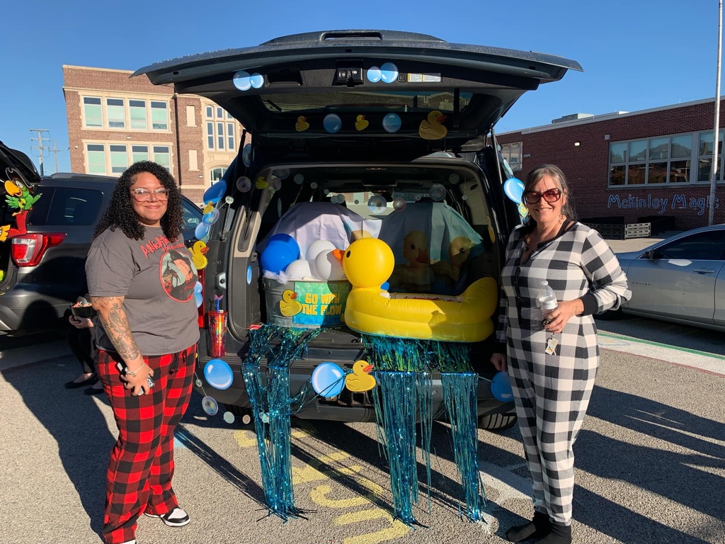 Students and families having fun at their trunk or treat event outside