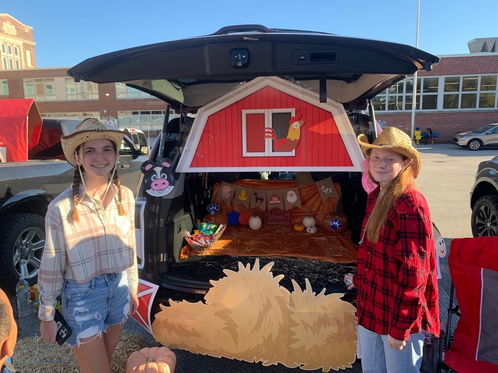 Students and families having fun at their trunk or treat event outside