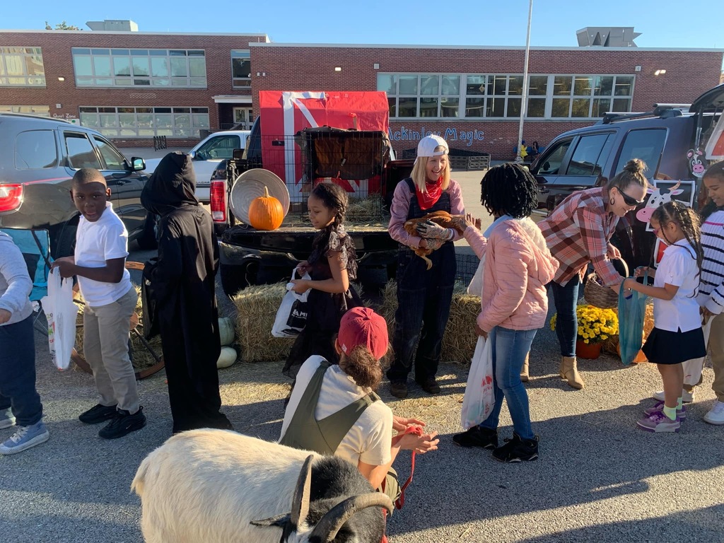 Students and families having fun at their trunk or treat event outside