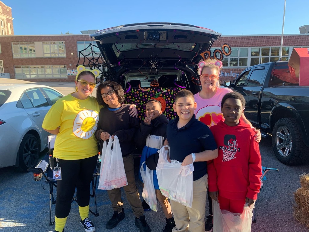Students and families having fun at their trunk or treat event outside