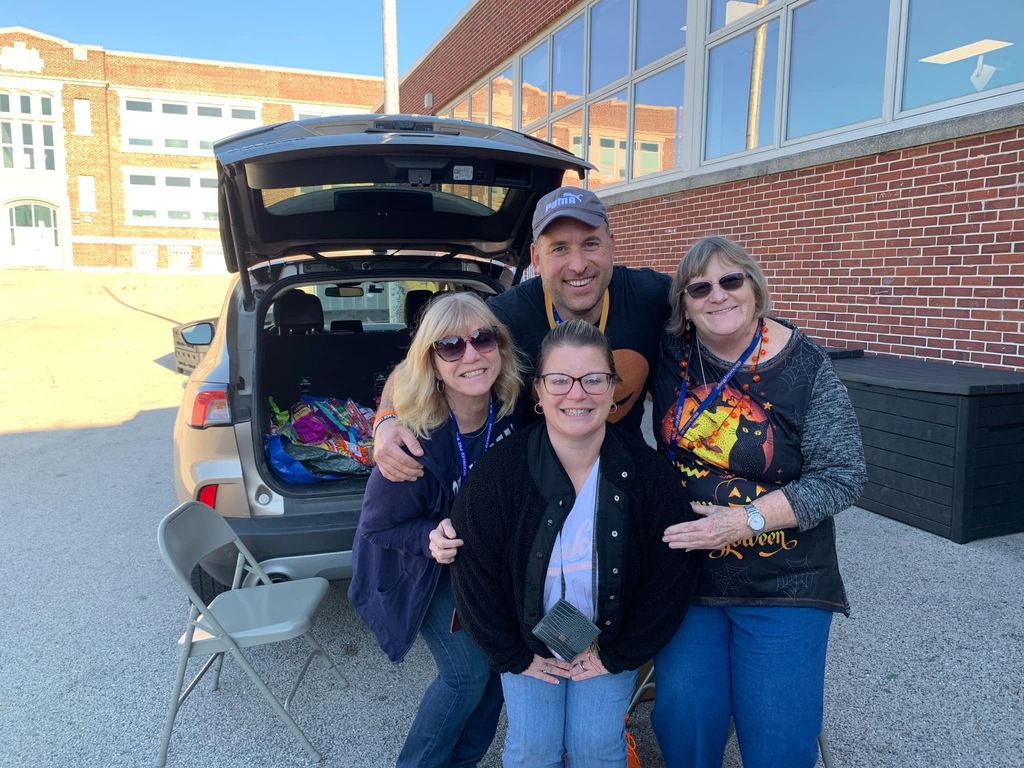 Students and families having fun at their trunk or treat event outside