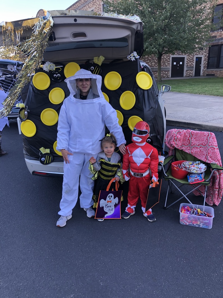 Students and families having fun at their trunk or treat event outside
