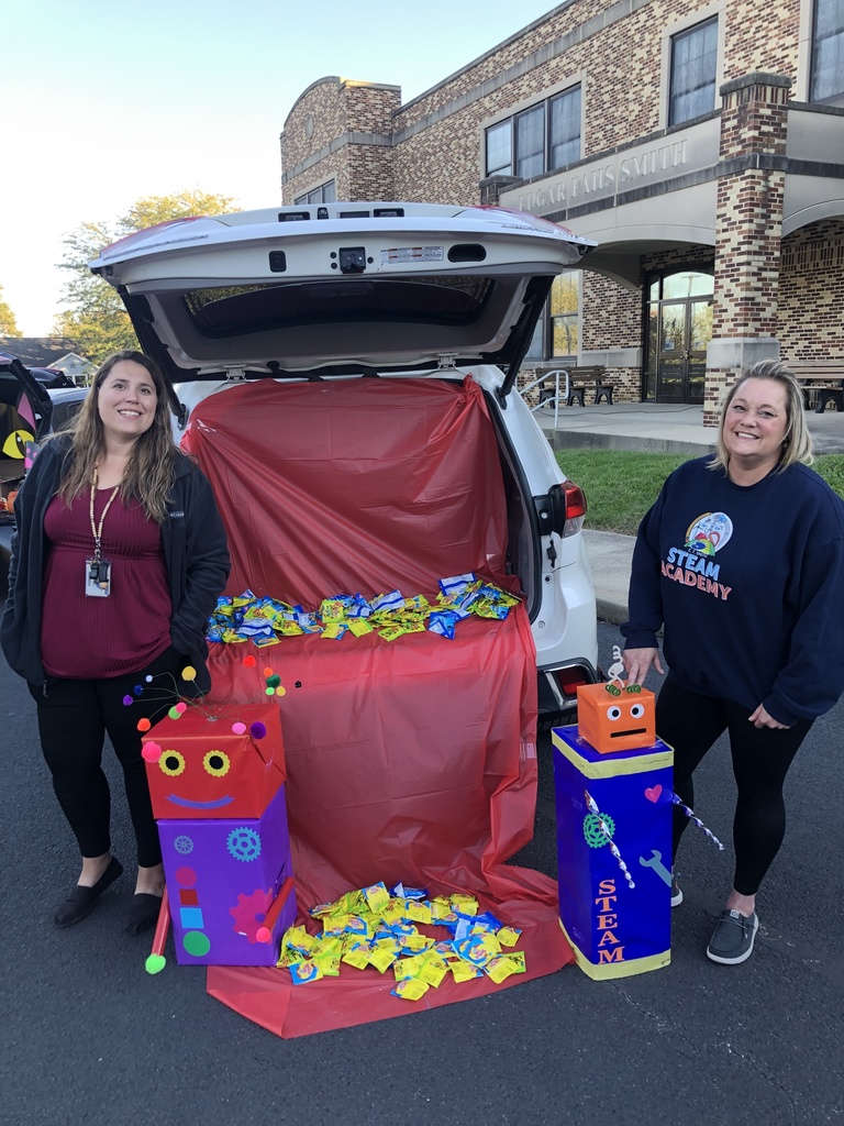 Students and families having fun at their trunk or treat event outside