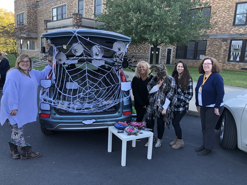 Students and families having fun at their trunk or treat event outside