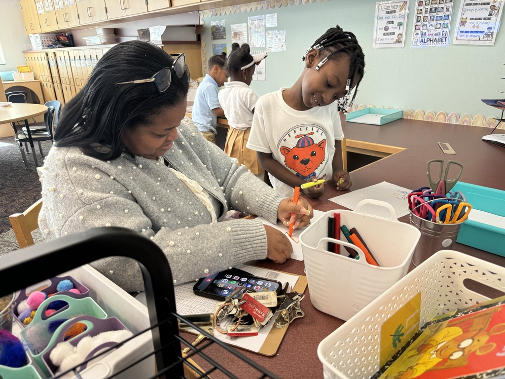 Dr. Berry working with student on writing