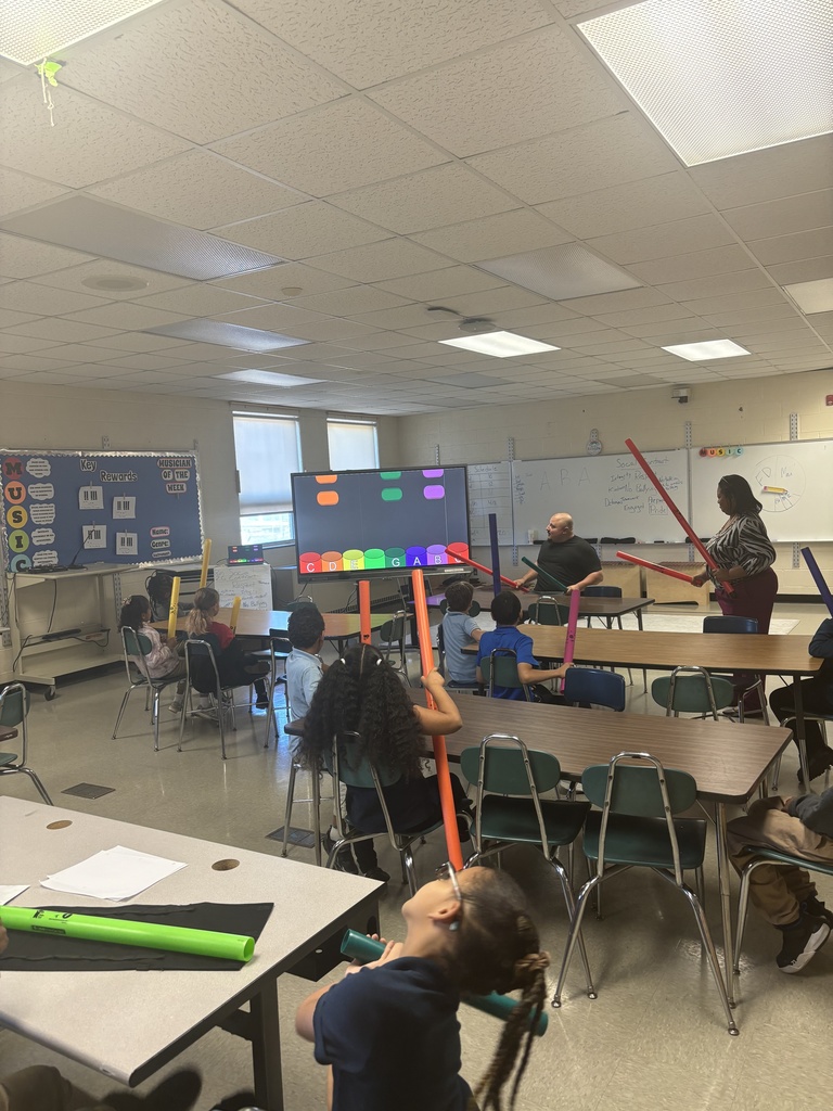 Music class participating in a music lesson