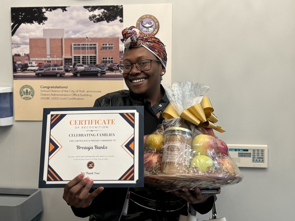 Celebrating Families Award recipient in the lobby of the Central Administration Building