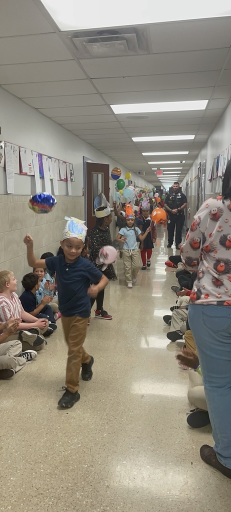 Students cheering with balloons