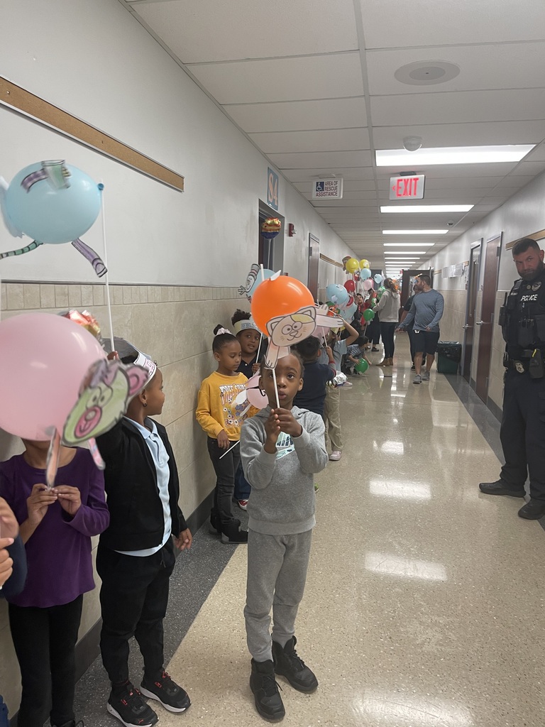 Students cheering with balloons