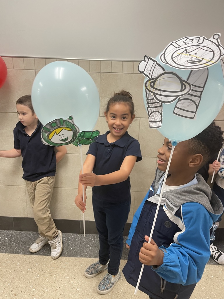 Students cheering with balloons