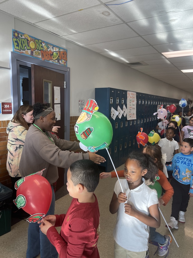 Students cheering with balloons