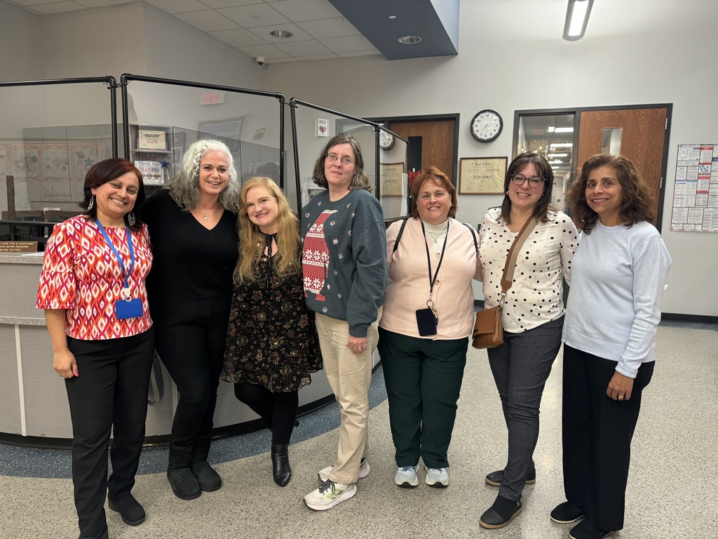 Photo of seven women smiling
