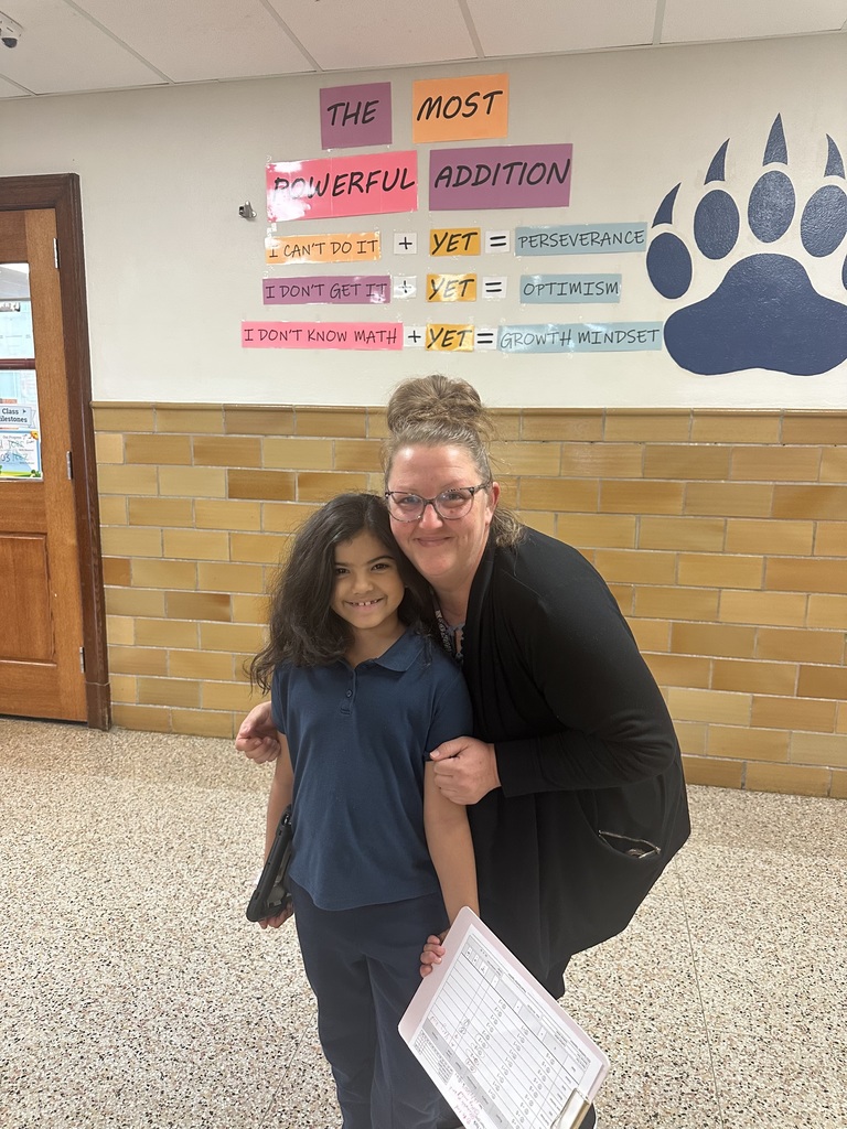 Photo of Principal and student smiling