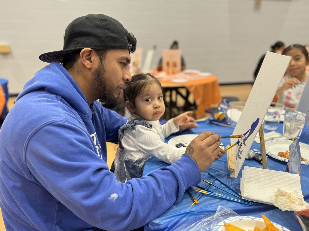 Families enjoying Ferguson's Coco and Canva event