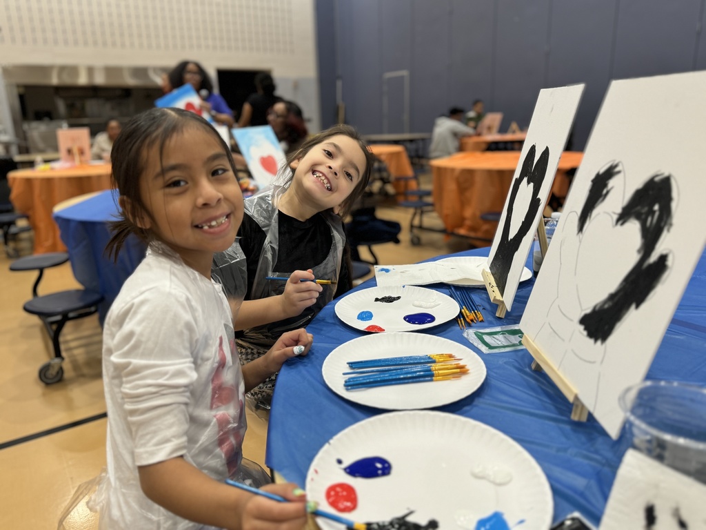 Families enjoying Ferguson's Coco and Canva event