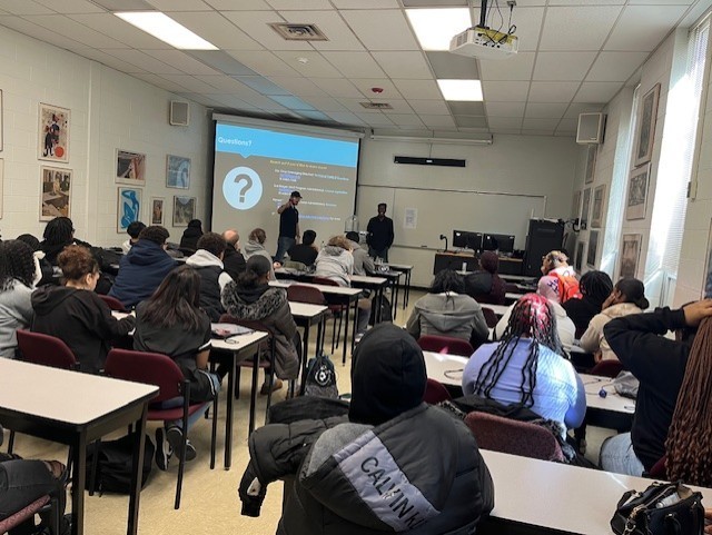 A group of students learning in a classroom 