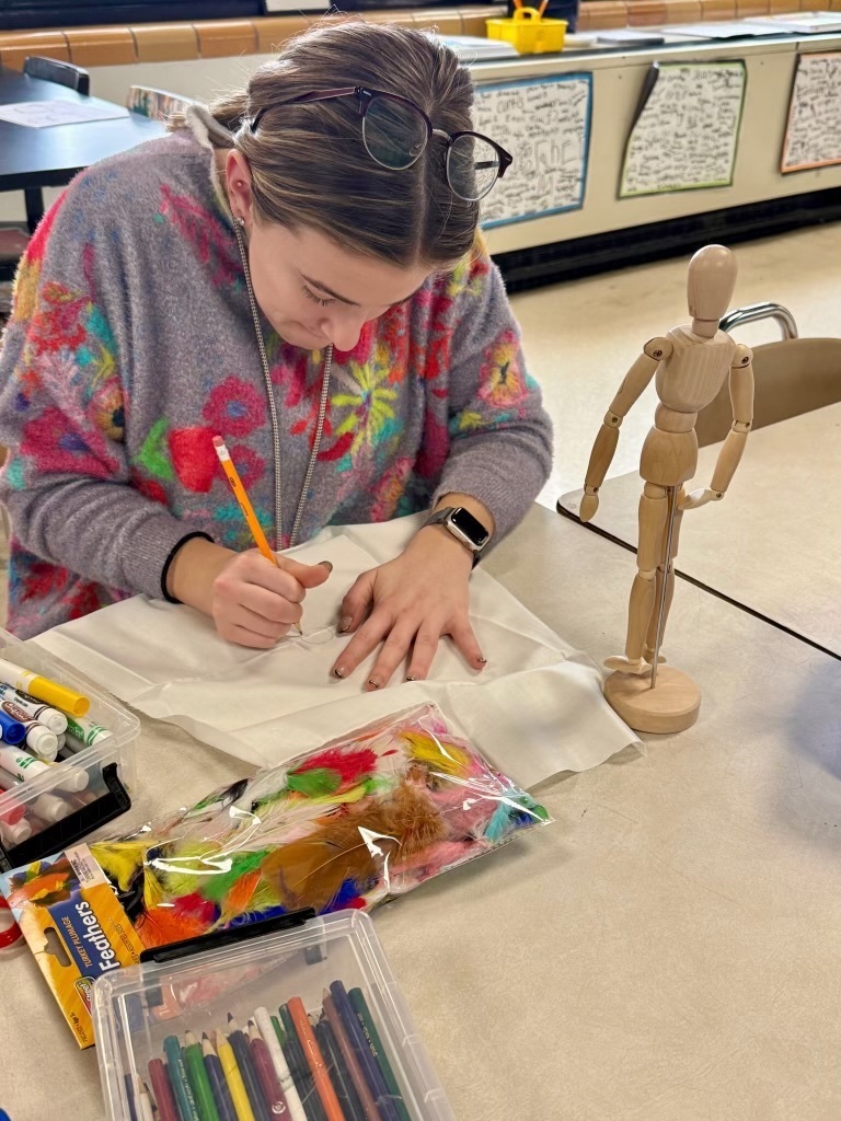 Person writing on a piece of paper 