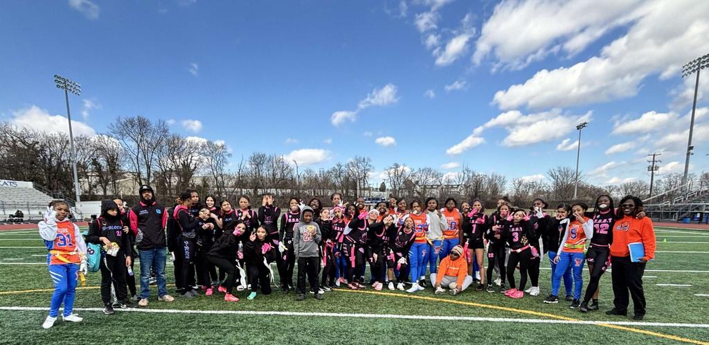 A group of students and adults smiling in a photo